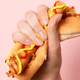 hand gripping hot dog forcefully